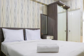 Cozy and Enjoy Studio Room at Green Pramuka City Apartment By Travelio